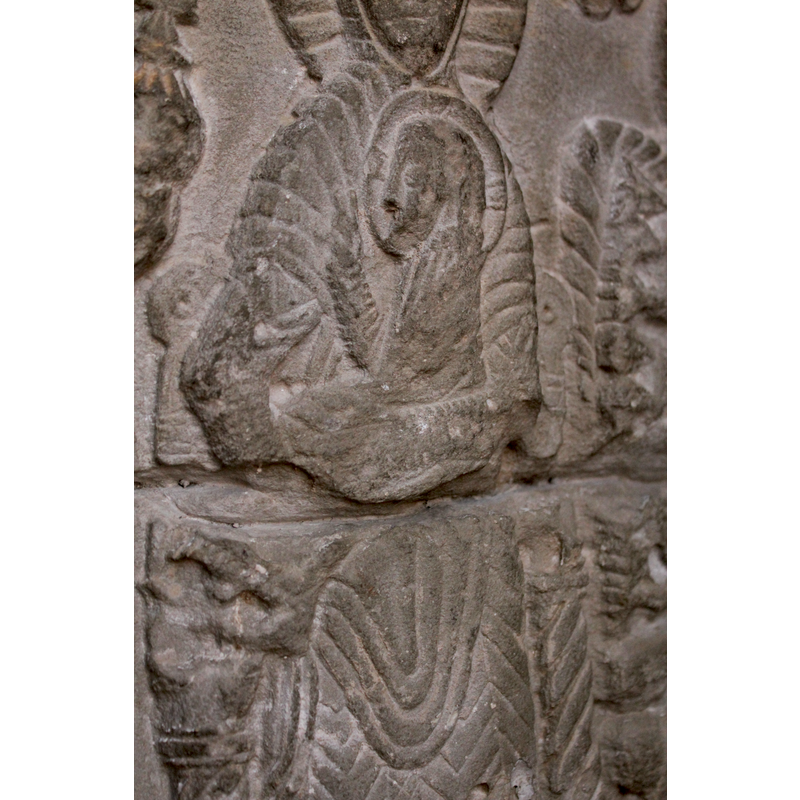 Christ Child, facing left;cruciferous halo; holds a little palm branch