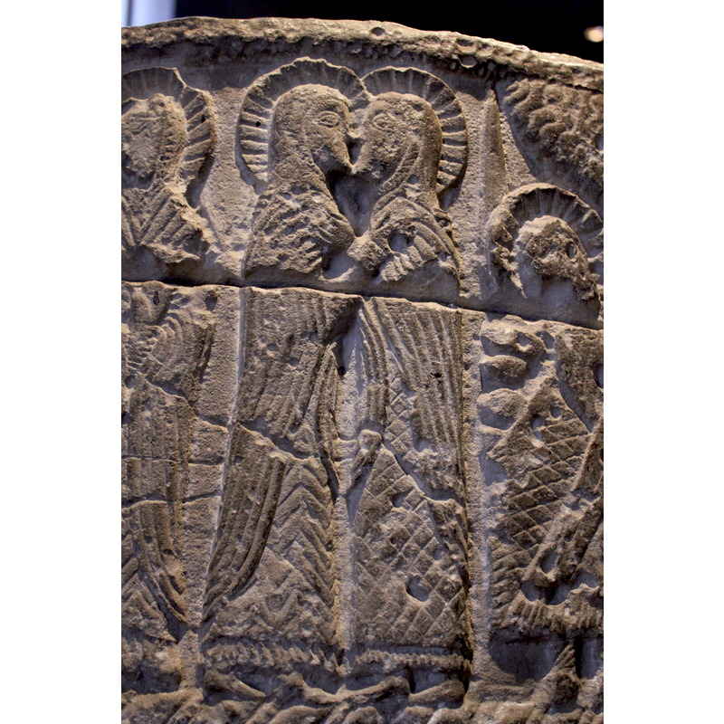 both figures haloed; kissing