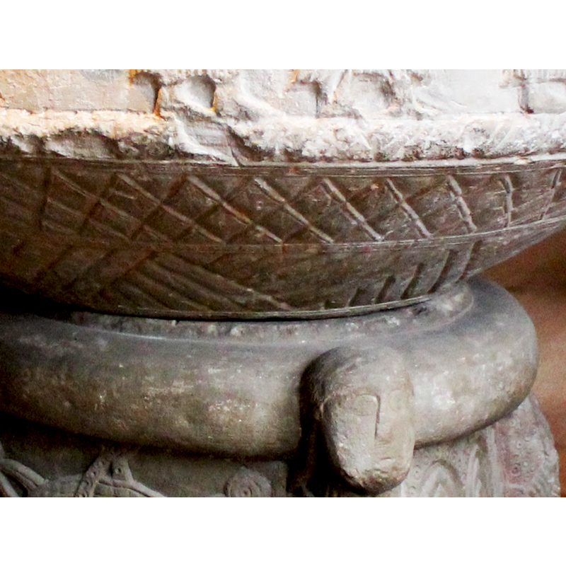 a very thick one; the heads of the angle figures of the base are part of it, except the one broken off