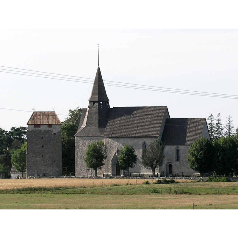 the view includes the fortified tower near the church