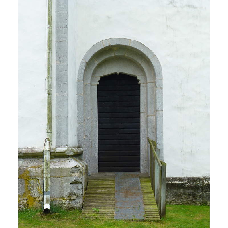 at the base of the west side of the tower