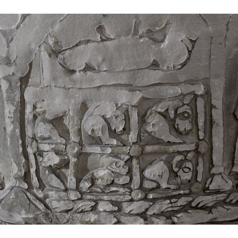 the figure of Christ Child faintly discernible in a bed or manger, as are four bulges above that could be the ox? the mule? a star? else? Beneath is a curious pen with six animals in it