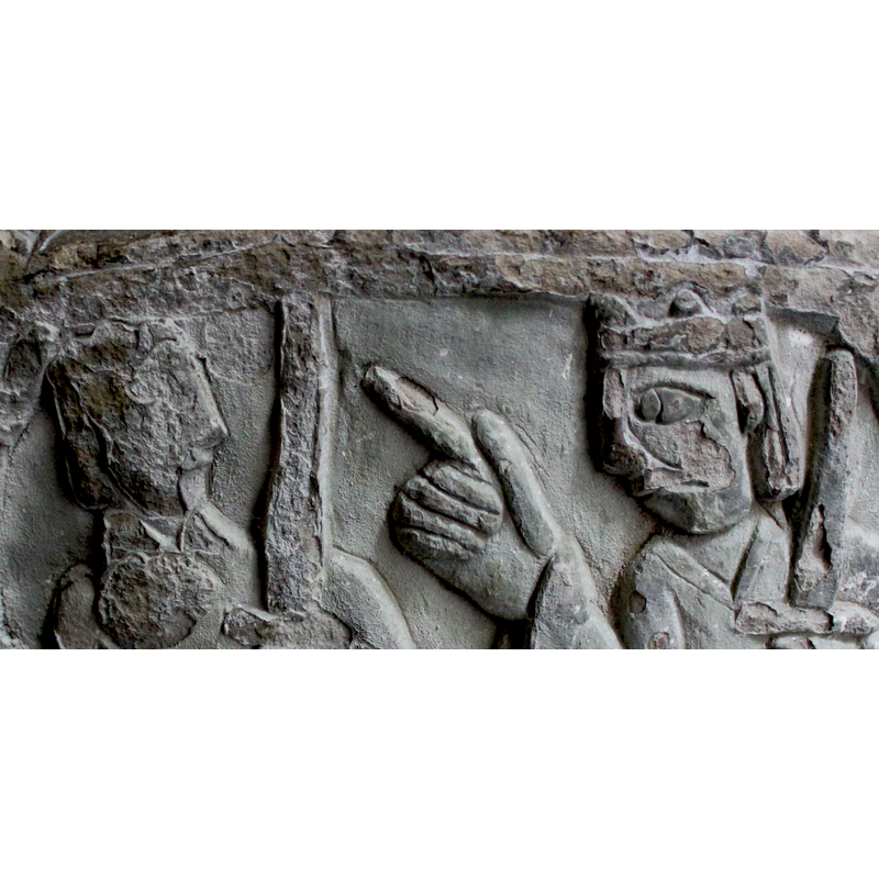tentative  identification -- two figures armed with swords; the one on the right crowned, seated; points index finger of his six-fingered to figure on the left; the standing figure on the left appears not to be crowned but the area of his head is damaged; carries a sword in his left hand, that arm dressed in a very wide sleeve, like those of the crowned figure to the right; his right hand is not visible. Is it Herod giving instructions?