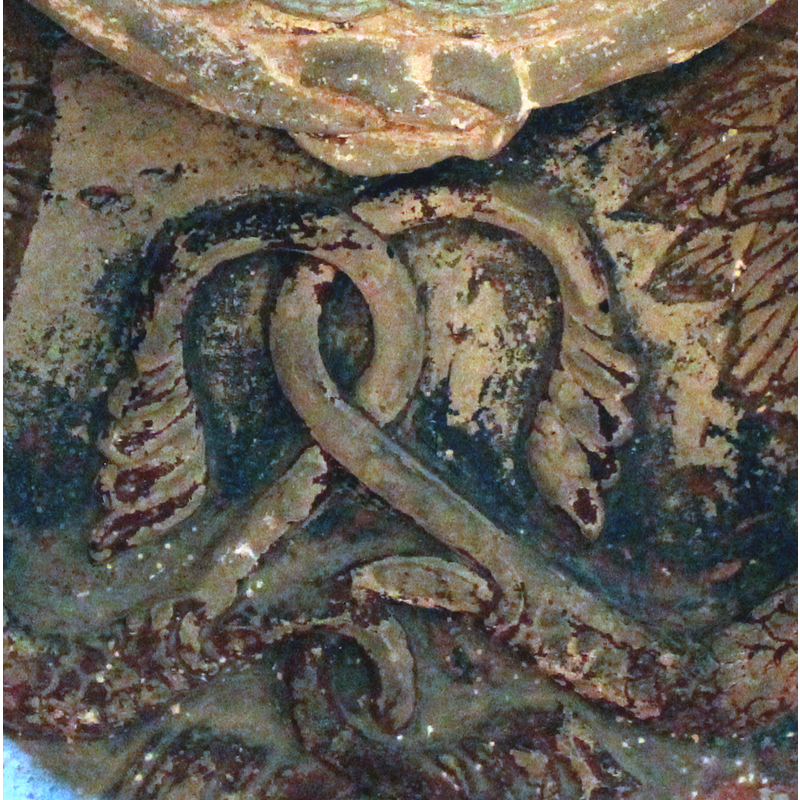 the acanthus-shaped tails of the two snakes are here tangled