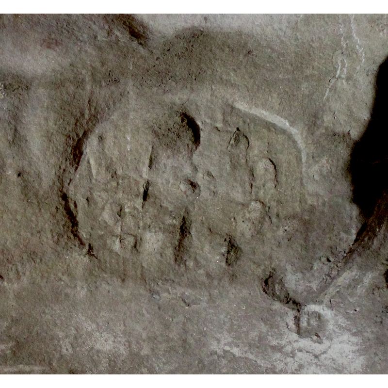 on the east side of the base -- there appears to have been an interlace, but it is much eroded now