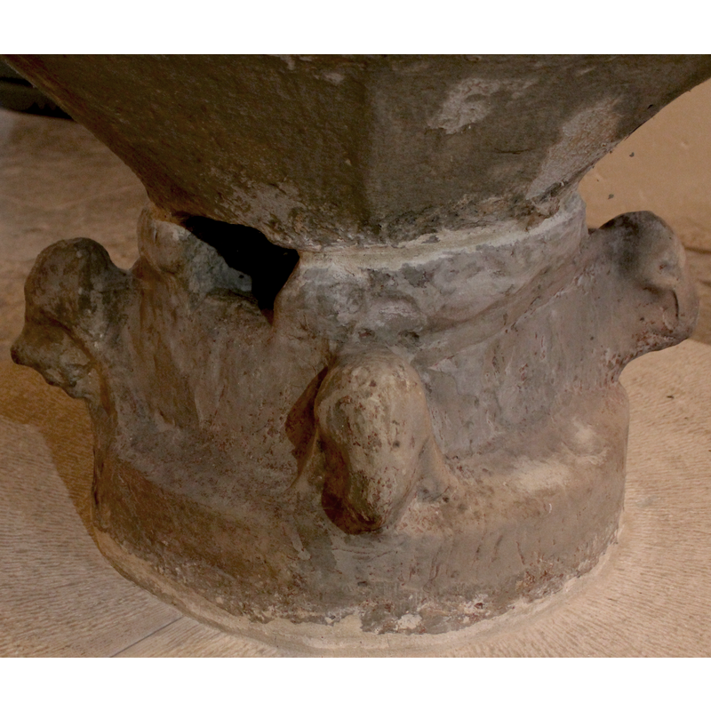 ram head on the right; centre and left appear to be lions -- notice the large drain hole carved in the centre ring