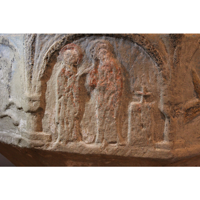 on the west side of the basin -- two haloed figures standing to the left of an altar with a cross on it