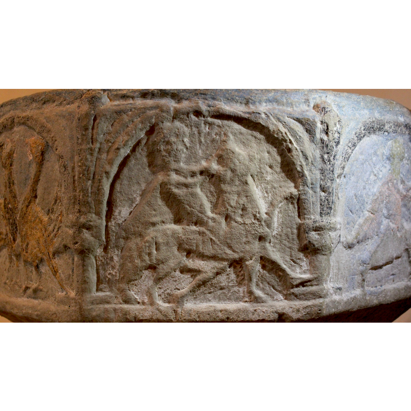 on the south side of the basin -- facing the right, Samson fighting the lion.