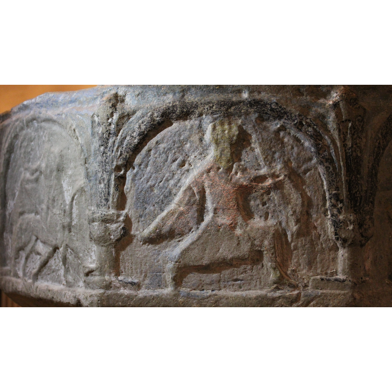 on the southeast side of basin -- caped archer holding bow and arrow; facing the right.