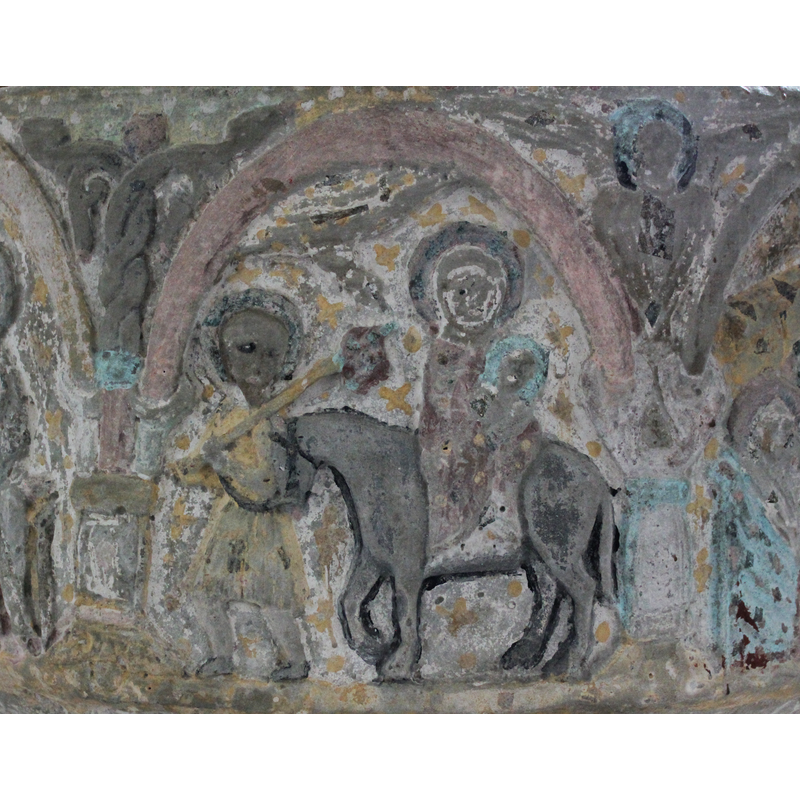 Haloed Virgin and Child on horseback. Hand of God coming down from a cloud on the upper left of scene. Joseph looks at viewer and wears a beard; carries a staff over his left shoulder with belongings in a cloth. [NB: narrative program proceeds from the right to the left].