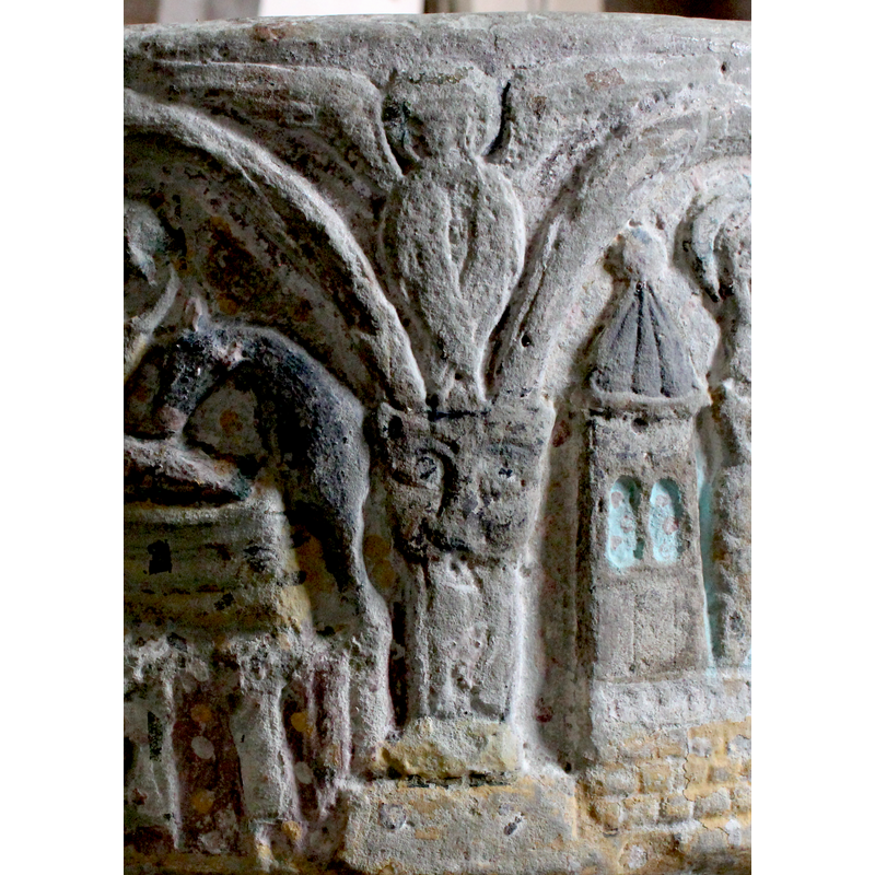 two open wings, two folded below; feline-head capital and square column below