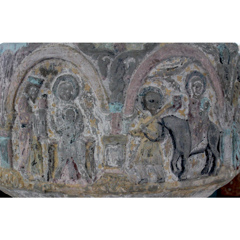 in the spandrel between the Adoration of the Magi (left) and the Flight to Egypt (right). The vegetal in the spandrels resembles an acanthus plant braided with two strands; the capital is different from those of the other columns, quite plain; ditto the column and its base