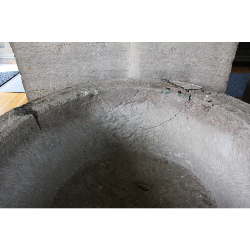 the damage to the basin affecting the west and nortwest sides; the hole in the nottom of the basin, probably a flaw in the stone