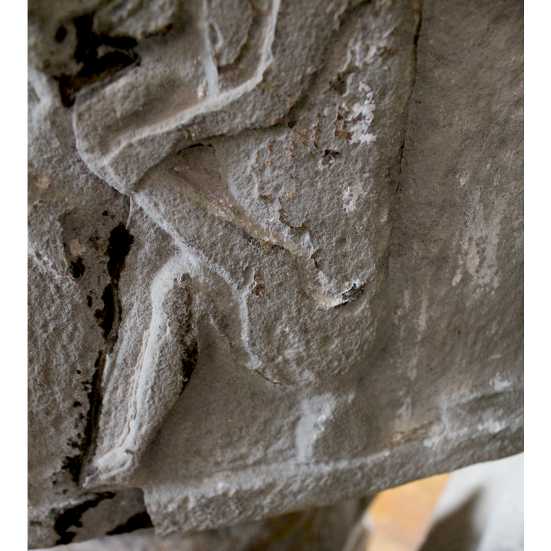 the lower part of Spinario's body; there appears to be no sign of the obvious falic component that often appears on this scene -- the carved surface is much eroded and damaged