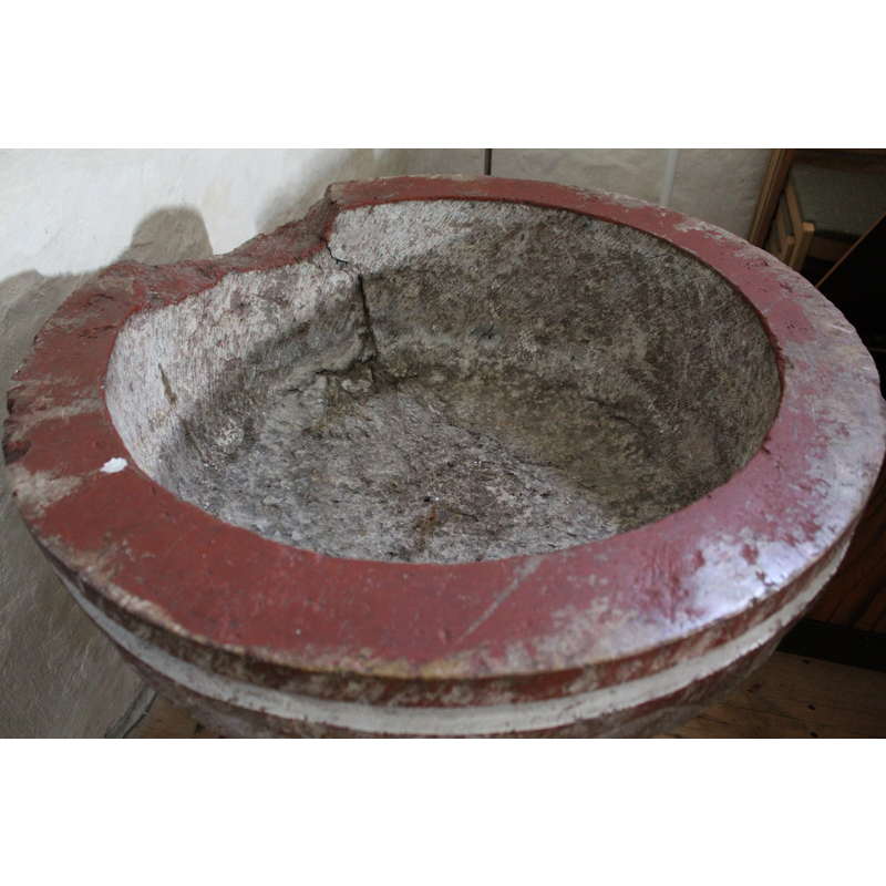 showing the damage to the upper rim and the sides