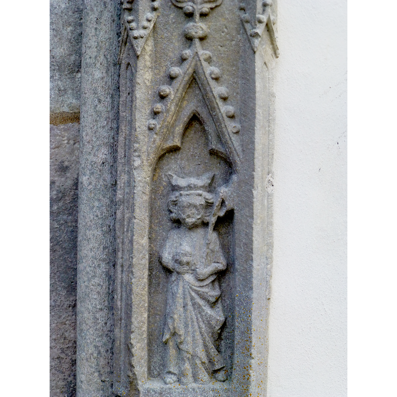 in the lower trefoiled and crocketed niche: a crowned male figure carrying an ax [St.Olaf? [aka Olaf II Haraldsson, king of Norway] not haloed]