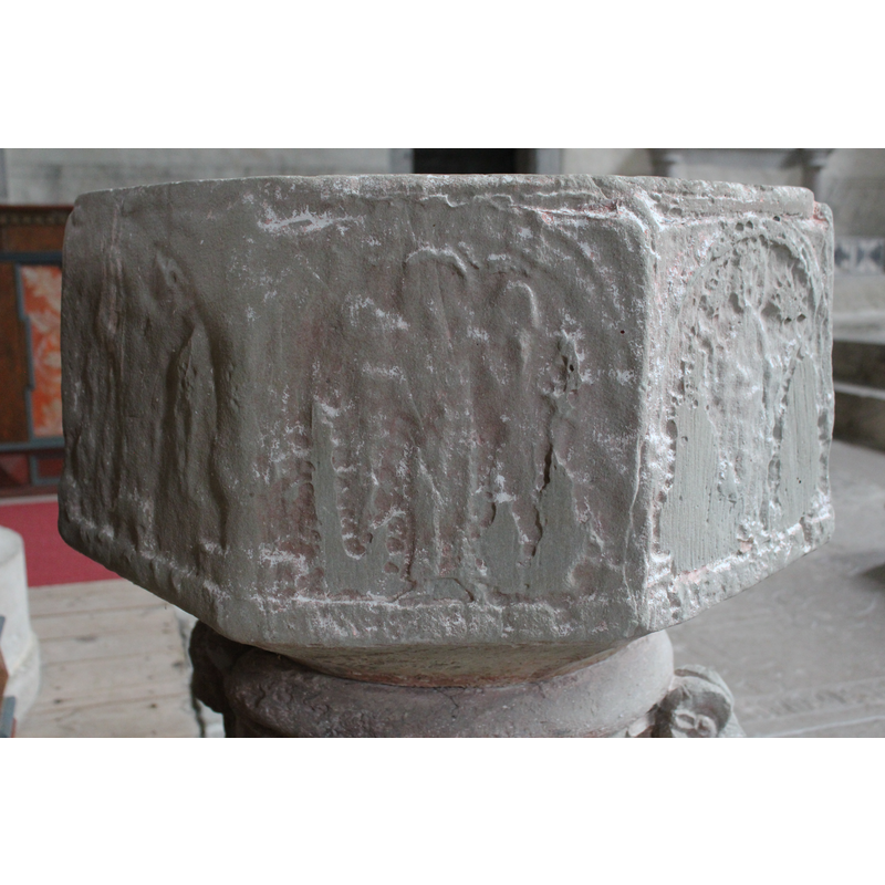 on the southwest side of the basin -- [orientation is approximate] -- seen here on the left panel; very worn now, but it could be a figural scene