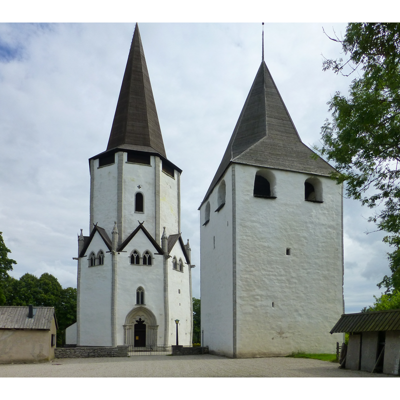 the building on the right is a fortified tower totally detached from the church