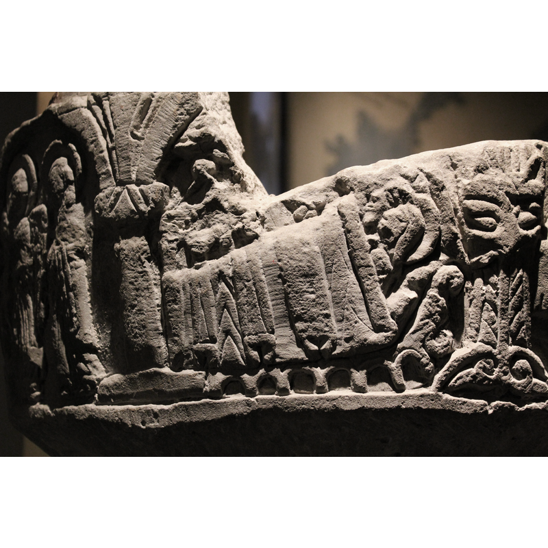 Under one arch, only the lower part of the scene remains. The scene contains a large bed, with rich coverings and an arched lower part - see Sighraf beds in Nativity - 6 arches, 7 columns, the headboard is to the right, and two heads are visible - the third has been destroyed, haloed heads. There appears to be an angel or clouds or wings on the left hand side.