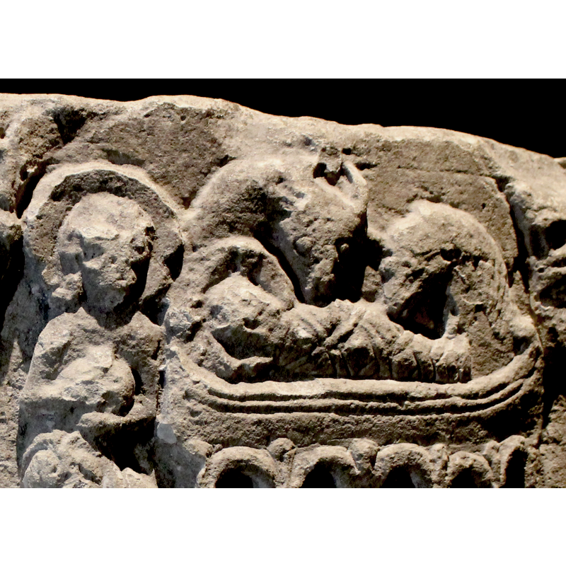 the cozy manger scene; a haloed Joseph holds his unidentified object