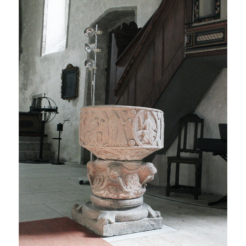 on the east side of the nave, by the pulpit and the chancel entranceway