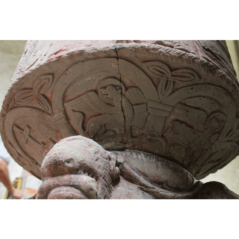 on the southwest side of the underbowl [orientation is approximate] -- a winged lion passant-regardant holding an open book -- Etimasia on the left; Luke's symbol on the right