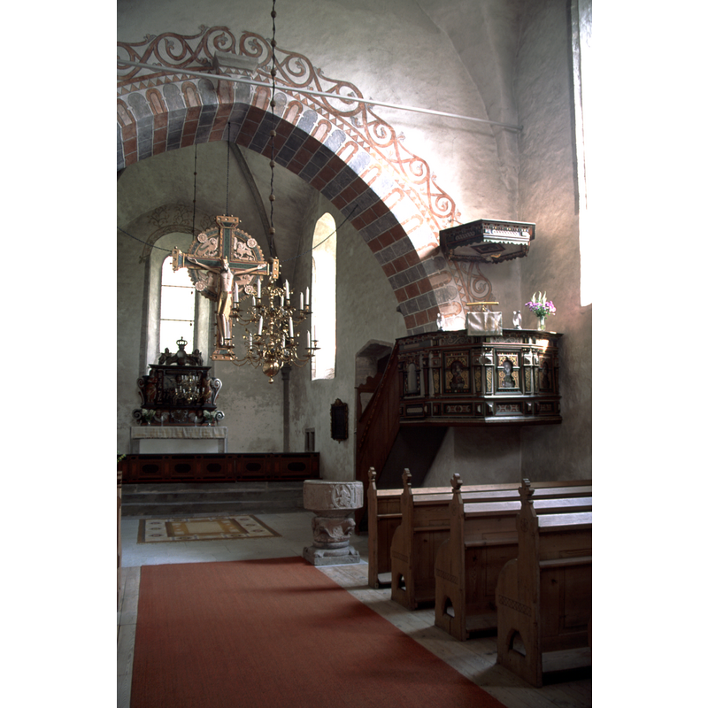 the font by the side of the pulpit, this side of the chancel arch