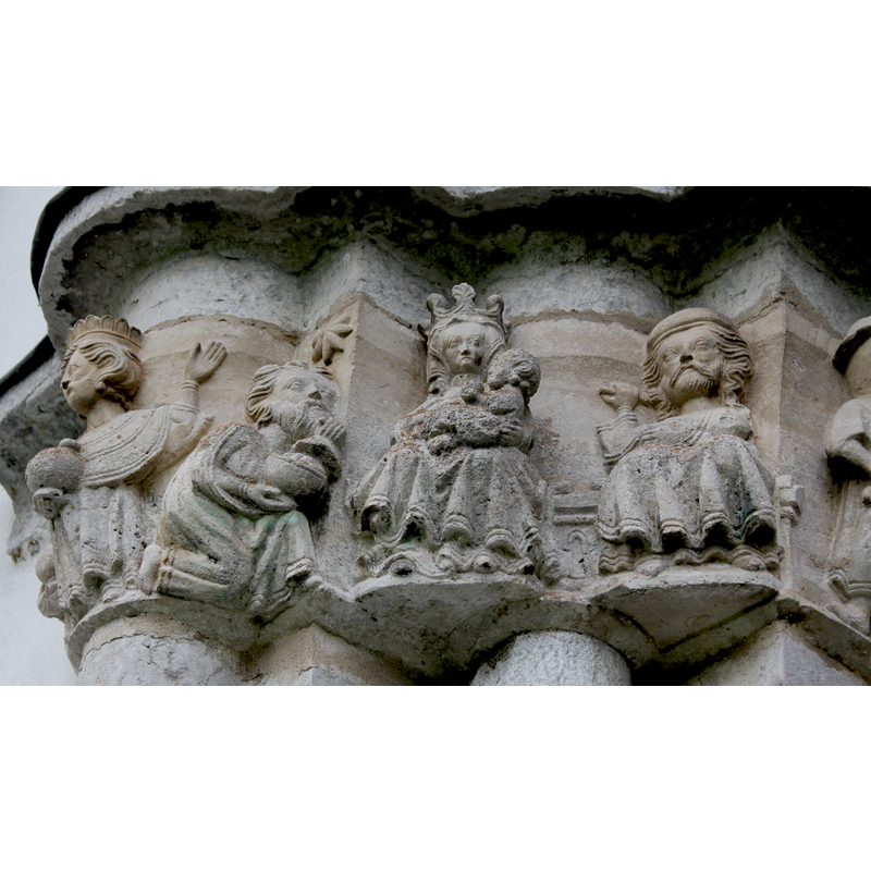 Adoration of the Magi: two Magi, one crowned standing, one bare-headed kneeling; crowned Madonna with Child on her lap; Joseph shares Mary's ornate bench/throne