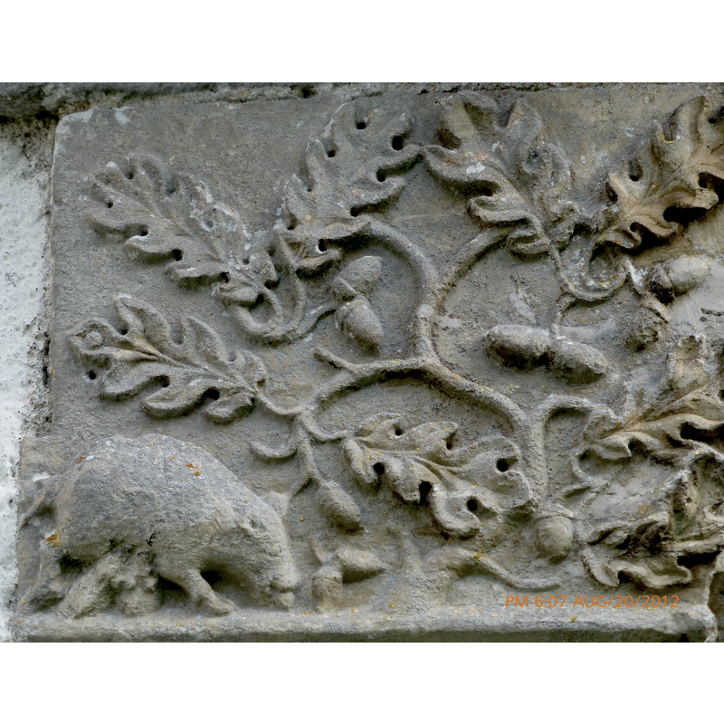 part of the Annunciation to the Shepherds scene: a sow with two suckling piglets feeds on acorns from an oak tree