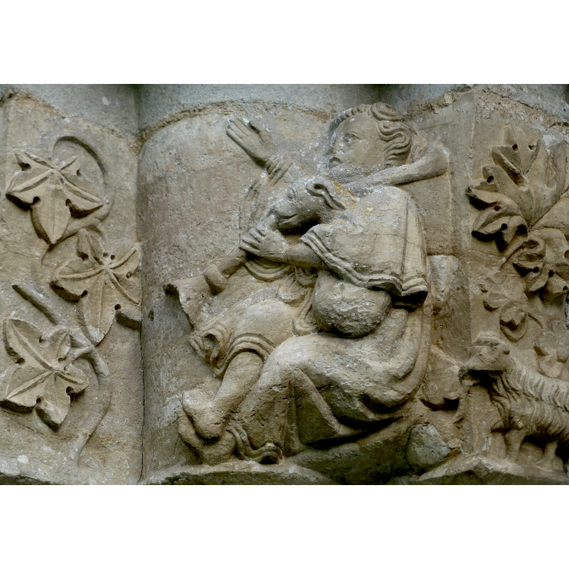 part of the Annunciation to the Shepherds scene: a seated shepherd shares celebrates the news with the help of his musically gifted dog