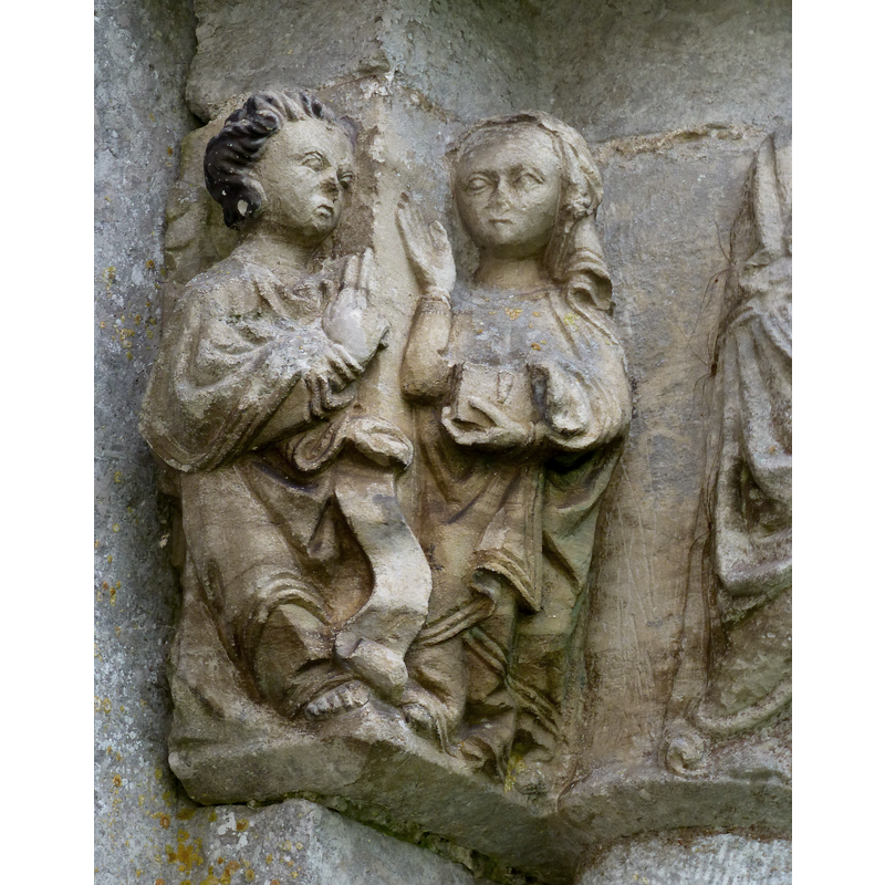 Annunciation to Mary: angel holding scroll on the left; Mary holding a book on the right