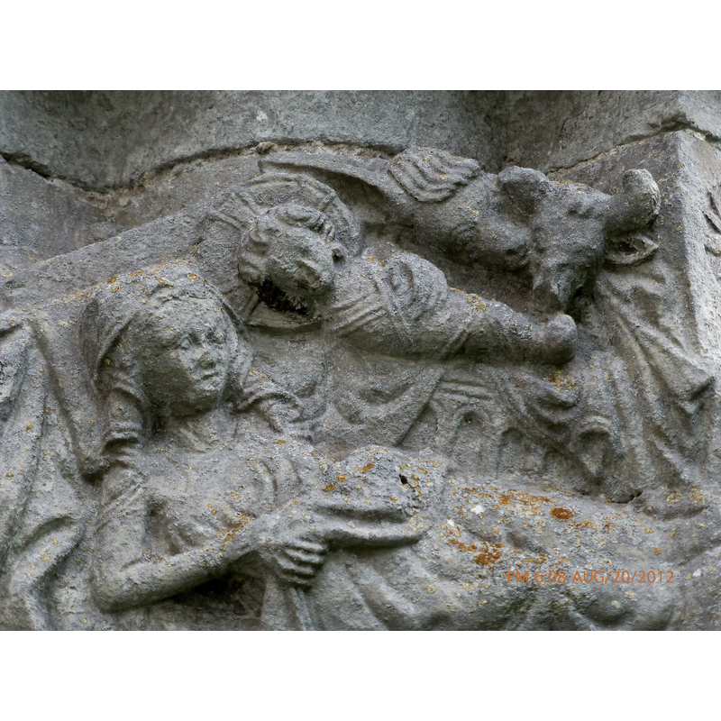 Nativity with Dream of Joseph scene; detail: Mary wears a head covering; her right hand holds the bed cover; her left arm is not visible but the right hand shows hugging the swathed body of Chirst Child from behind; the Child with a cruciferous halo lying on a rich manger that has an arcaded base; above, the ass is friendly towards the ox