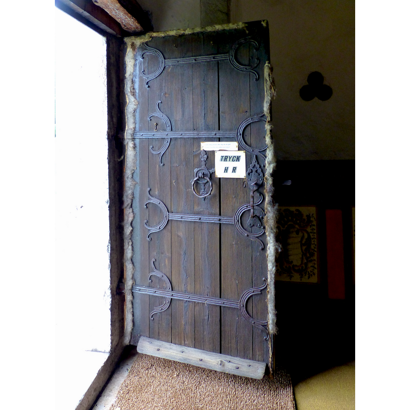 as was the medieval custom, this door uses sheep's wool as insulation around its perimeter; the design of the ironwork is also typical of Gotland church doors