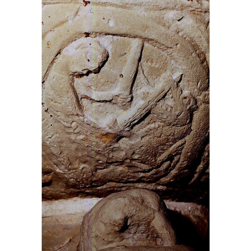 The figure on the left is holding a sword in his right hand and a stick or club in his left hand; he is fighting a dragon that has a crocodile-like head. Roosval (1918) suggests the Labours of Hercules for scenes 2-3-4 of the underbowl