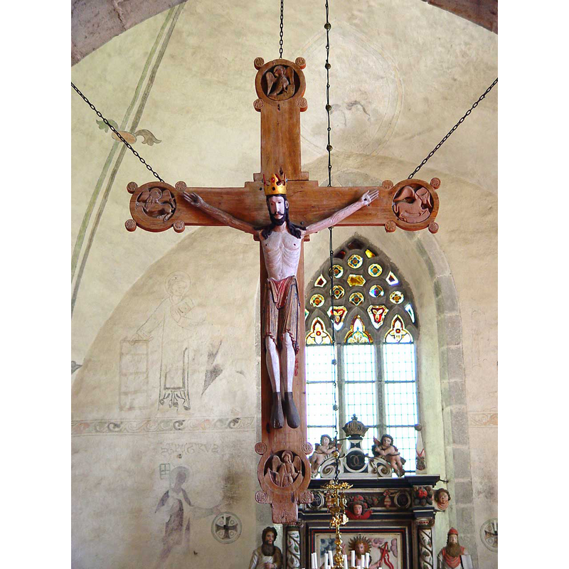the 12th-century reredos in the context of the chancel -- the mural paintings in the chancel are said to be of the 13th century; St. Lawrence and his gridiron to the left of the crucifix