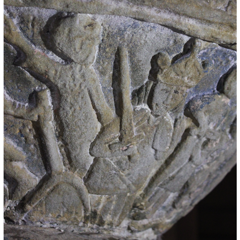 the figure on the left, arm raised diagonally, may be the announcing angel of the previous scene -- Herod (?) enthroned and crowned, sword held in his right hand, point up, directs the massacre of the innocent