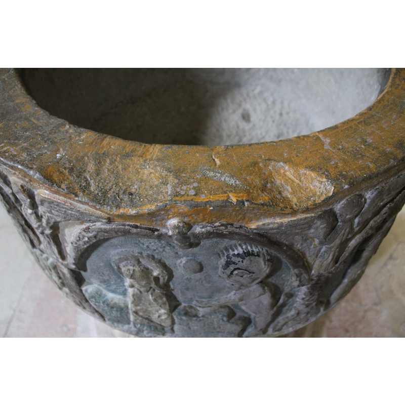 two depressions on one side of the rim; perhaps related to an old cover