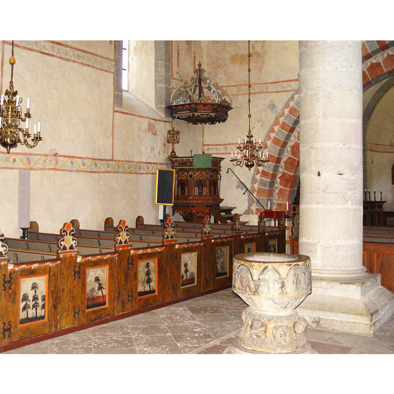 showing the late-Romanesque font and the 18th-century pulpit