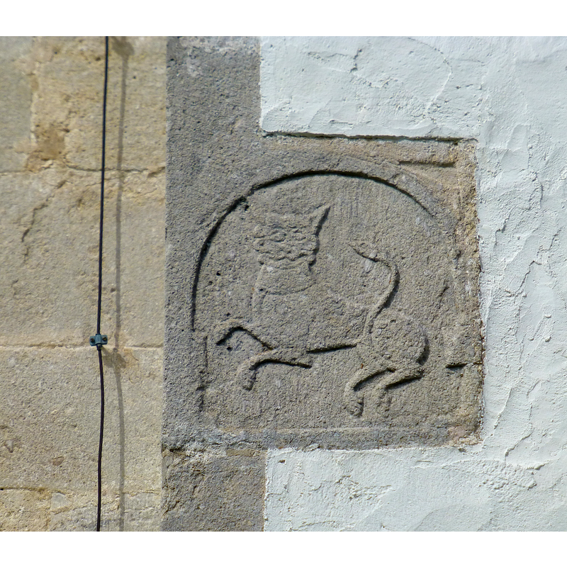 located up and to the left of the southwest portal; the left stone work visible here is the fabric of the tower