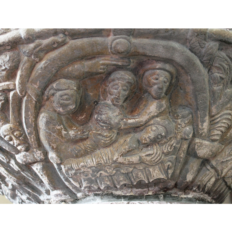 UNDERSIDE OF THE BOWL: Christ's Nativity. There are two people holding the infant while the Virgin reclines on a bed. These two figures may be servants or one of them might be Joseph.
