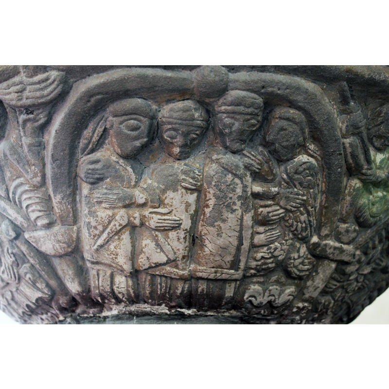 VISITATION SCENE: This arch contains four figures, and probably two scenes. (underside of bowl) the scene on the right, two figures. The figure on the right is an angel - it has wings, and points the right hand to the figure next to it. The figure to its left is in profile but look full front  - and has both hands extended to the angel on the right. The next scene (on the left of the colmposition) - two figures in profile, embracing =- the figure to the right of the two looks full front - the figure on the left has a head in profile. On the arch in the top middle is a sphere with a cross on it. ON THE SPANDREL an angel. THESE TWO SCENES REPRESENT THE VISITATION AND THE ANNUNCIATION.