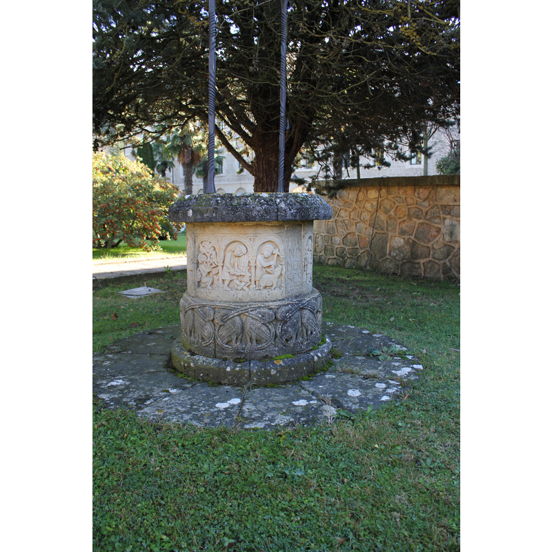 monastery extramural gardens: well-head with replica sculptures (Labours of the Month?); detail