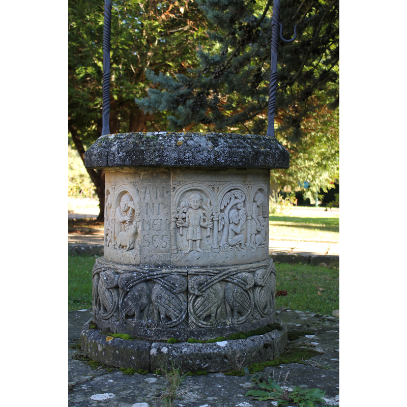 monastery extramural gardens: well-head with replica sculptures (Labours of the Month?); detail