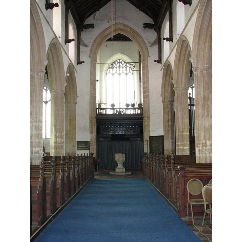 the font beneath the tower arch