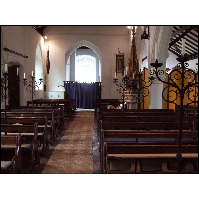 the font and cover visible at the west end, by the north arcade