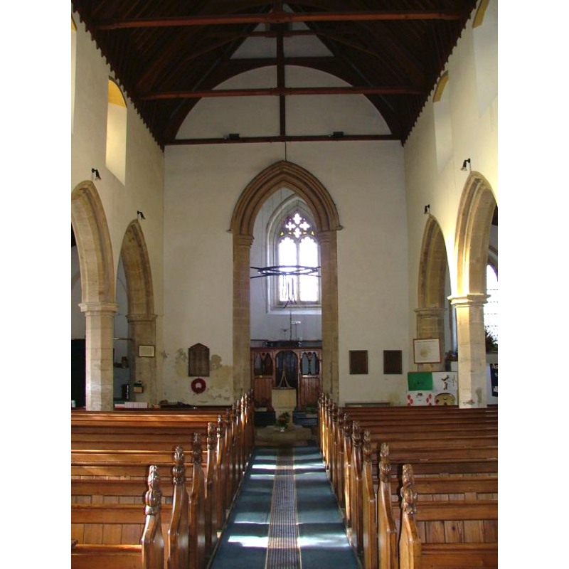 the modern font visible at the back (west), in the centre aisle