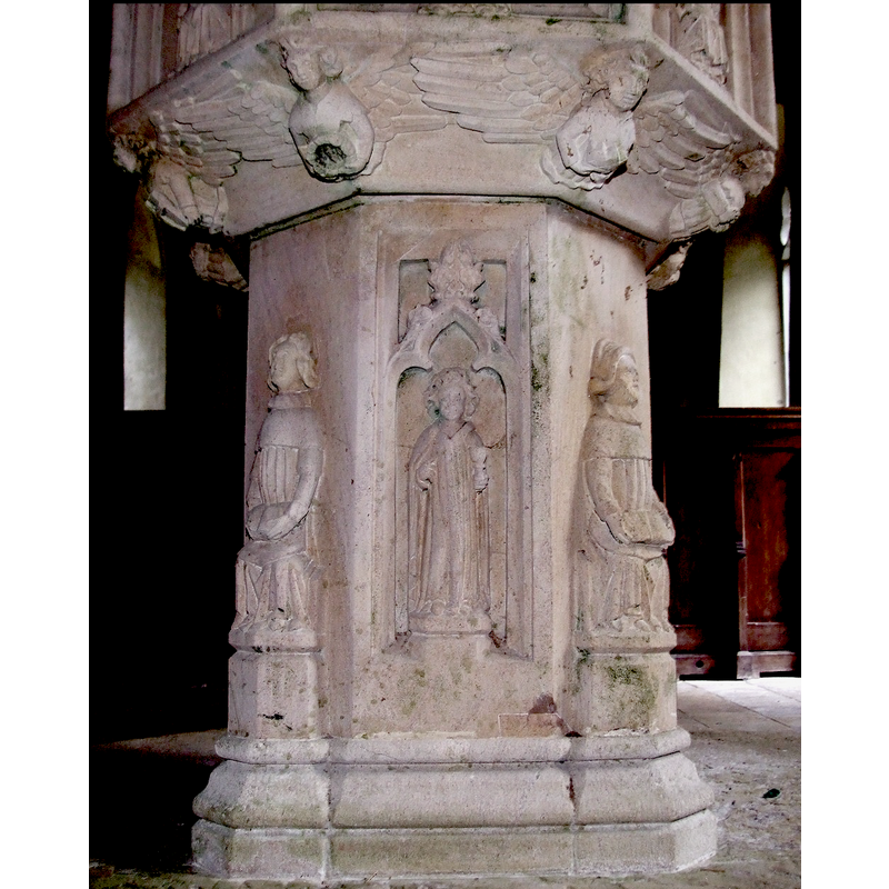 on the west side of the stem -- holding a chalice in the left hand; appears to be young and male; St. John the Evangelist?