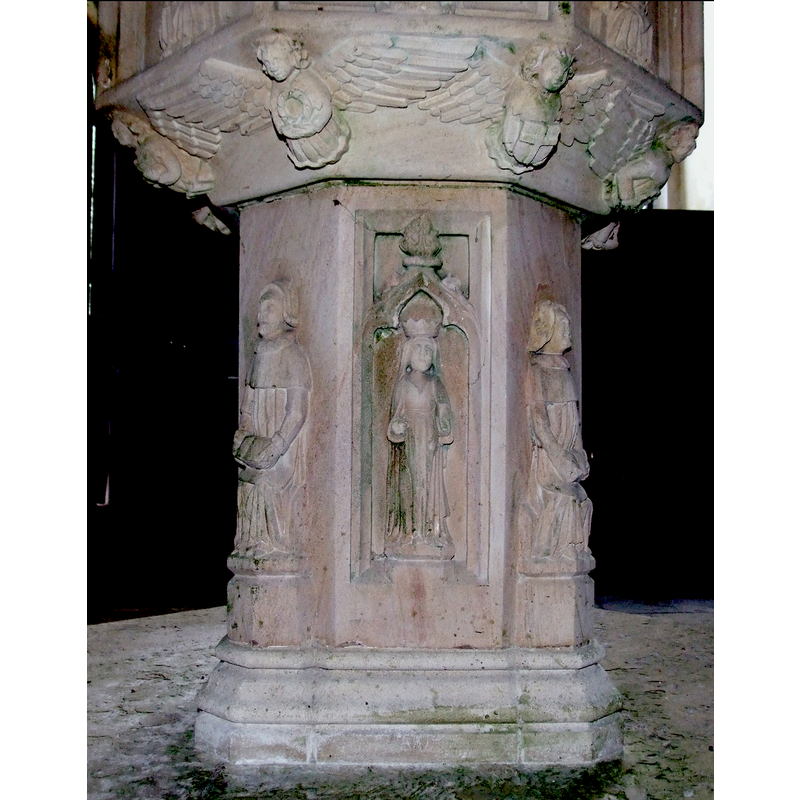 the figure is female and crowned; holds objects in both hands; not haloed