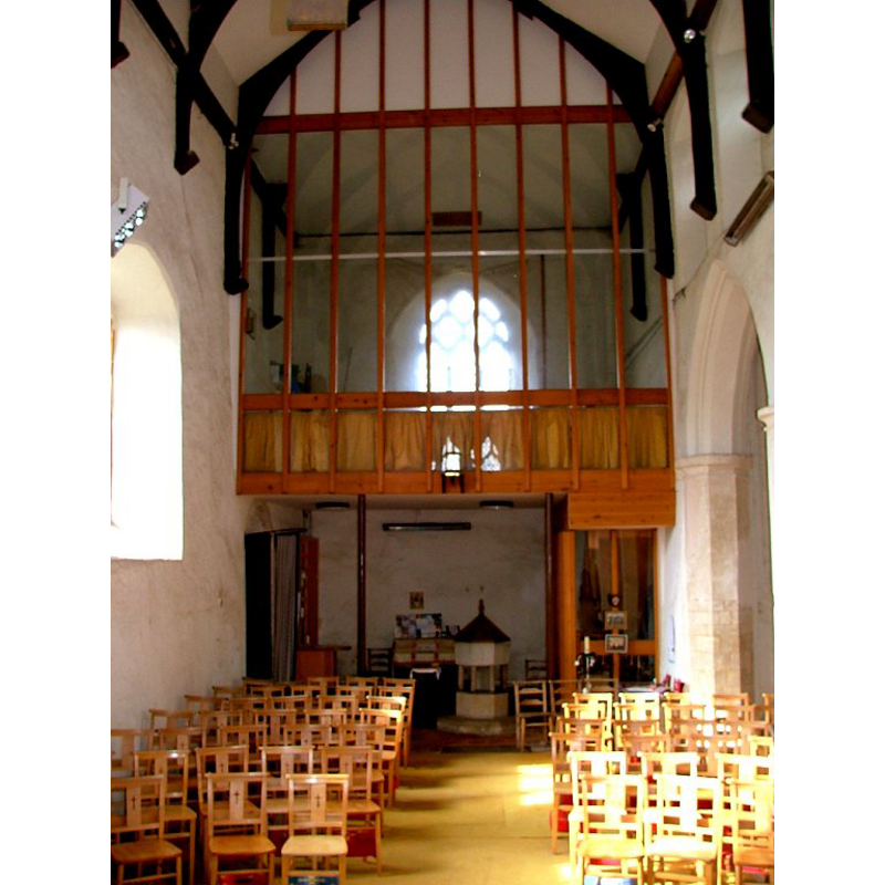 the font and cover at the west end, beneath the gallery