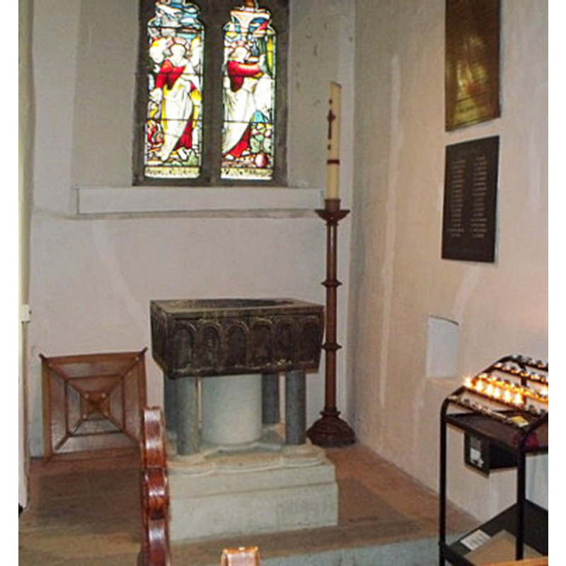 the cover standing, to the left of the font